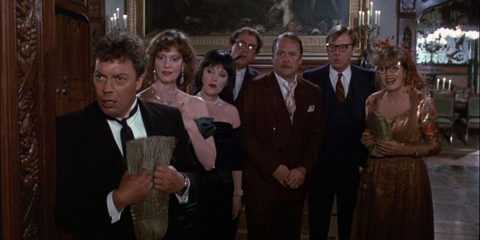 The cast of Clue looking at something in shock