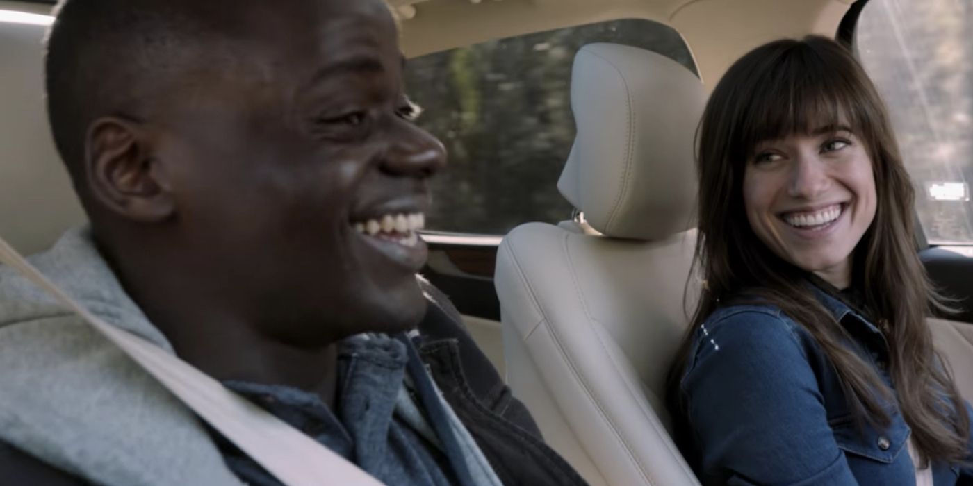 Rose and Chris laughing in the car in Get Out.