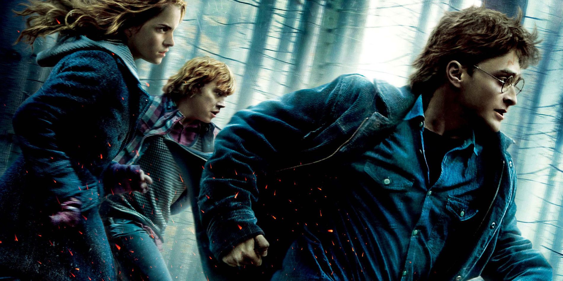 Harry Potter and the Deathly Hallows Part 1 Poster of Harry Ron and Hermione running through a forest.