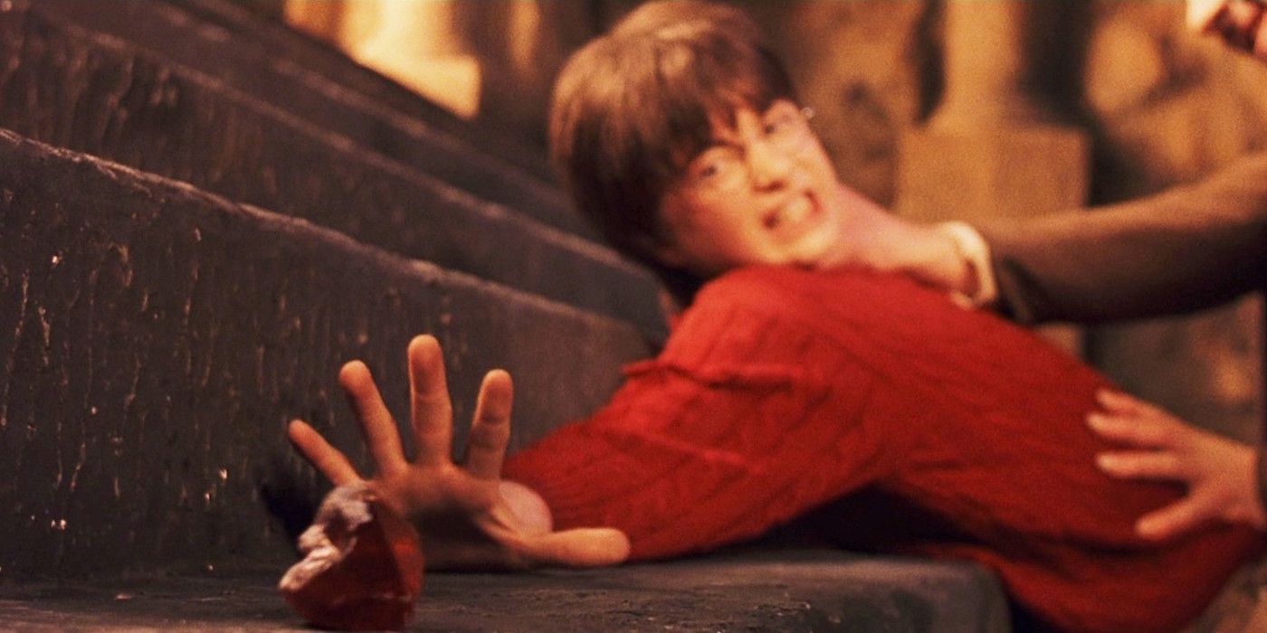 Harry Potter reaching for the Sorcerer's Stone
