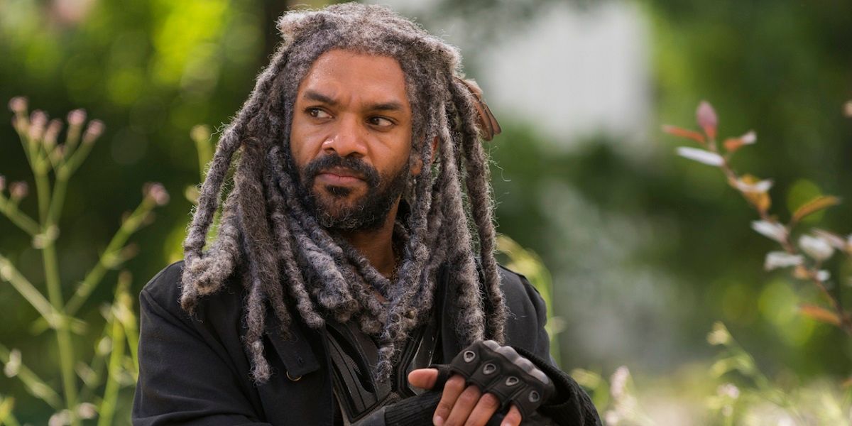 Ezekiel in the woods looking to his right in The Walking Dead