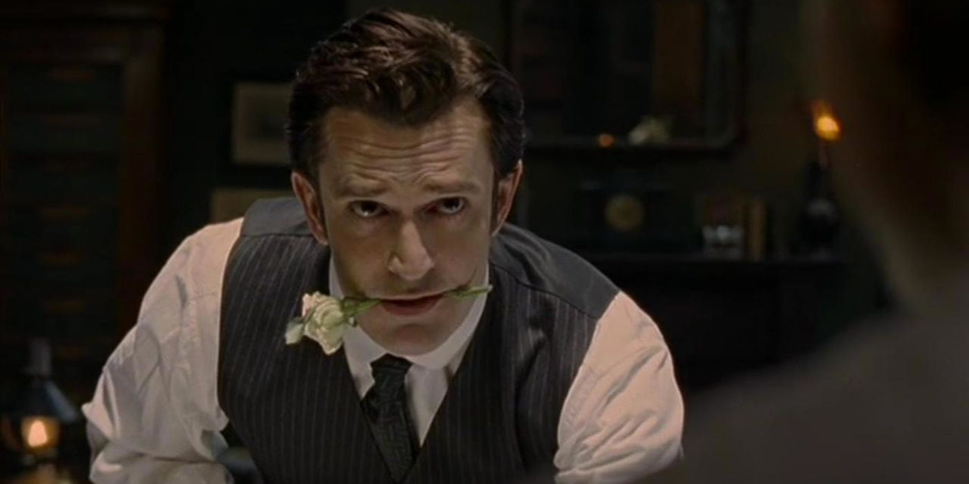 Sherlock Holmes with a flower in his mouth