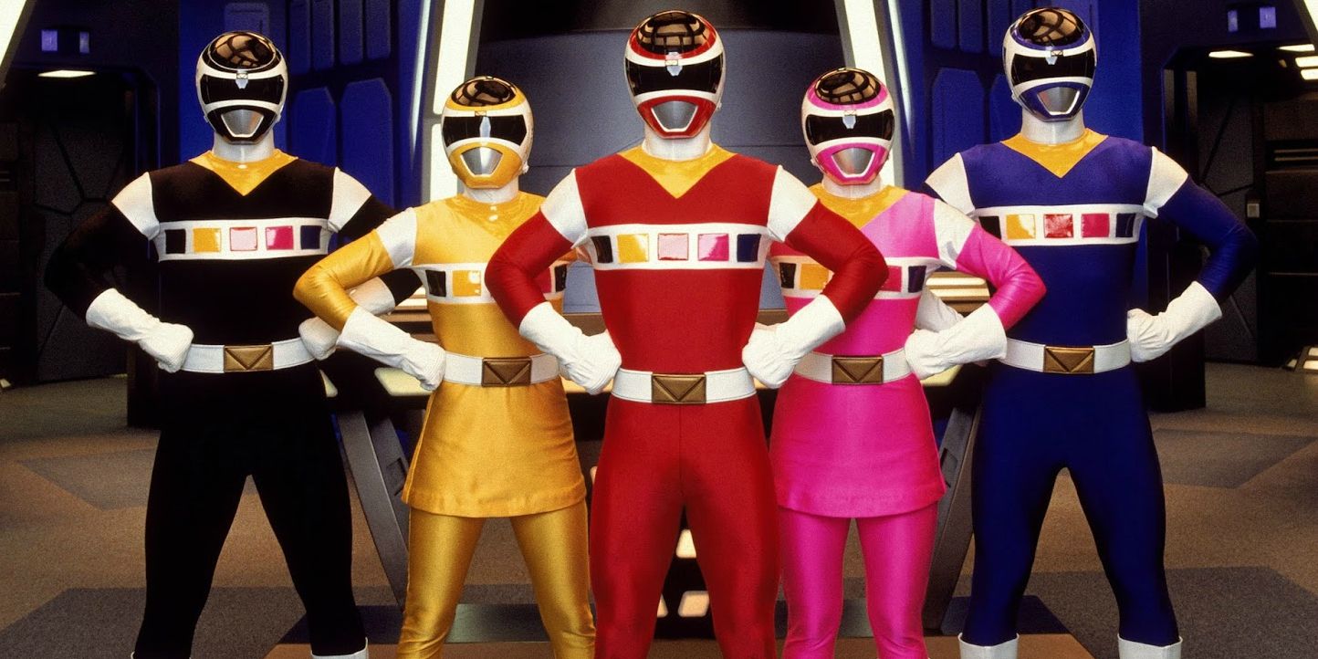 Power Rangers In Space team poses in uniform with their hands on their hips