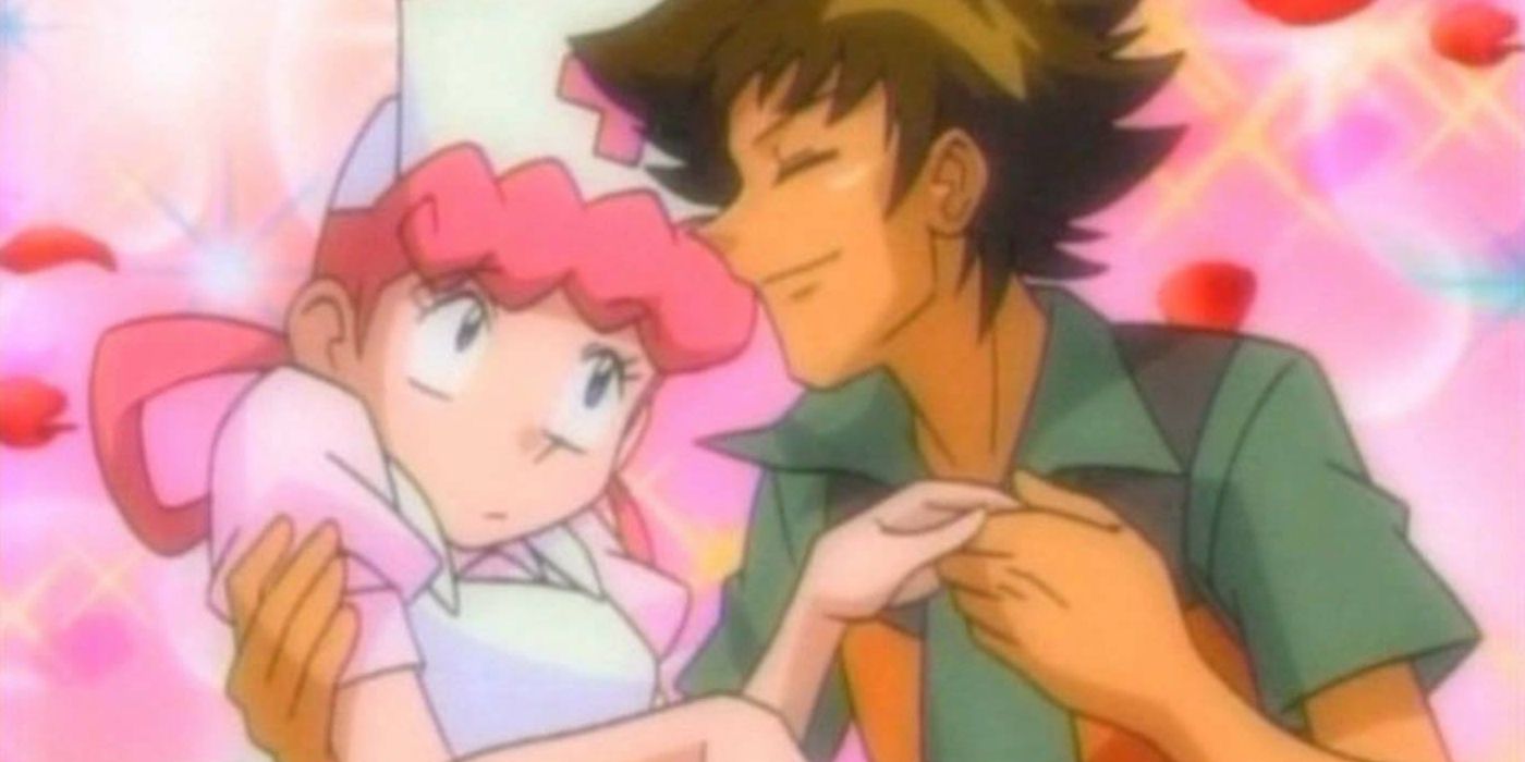 Brock hold Nurse Joy as they are surrounded by pink hearts