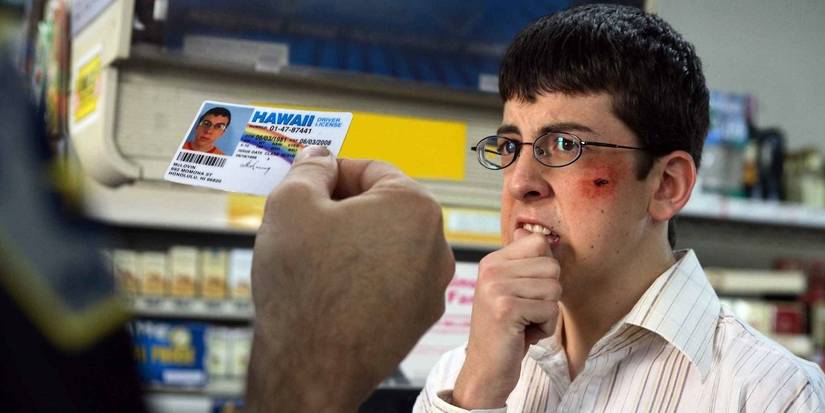 Christopher Mintz Plasse as Fogell looking nervous while someone checks his ID in Superbad.
