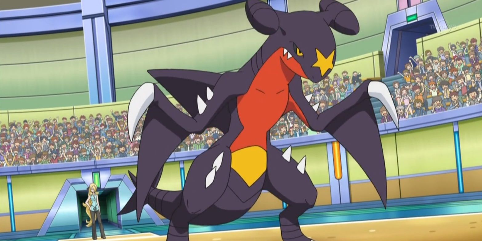 Cynthia's Garchomp stands in an arena in the Pokémon anime