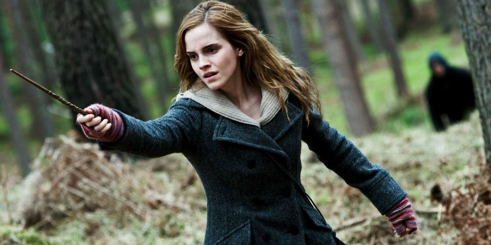 Hermione Granger holds her wand in the Forest of Dean