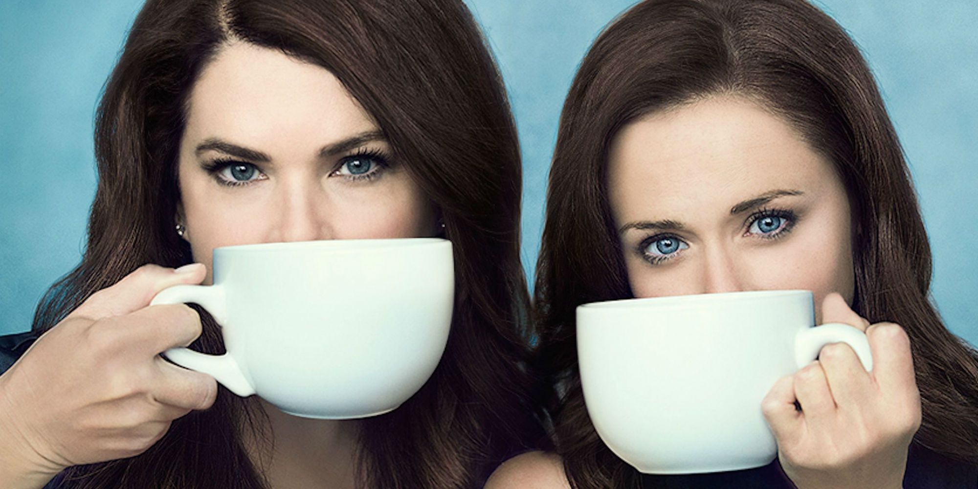 Lorelai and Rory covering their mouths with cups of coffee in Gilmore Girls A Year in the Life