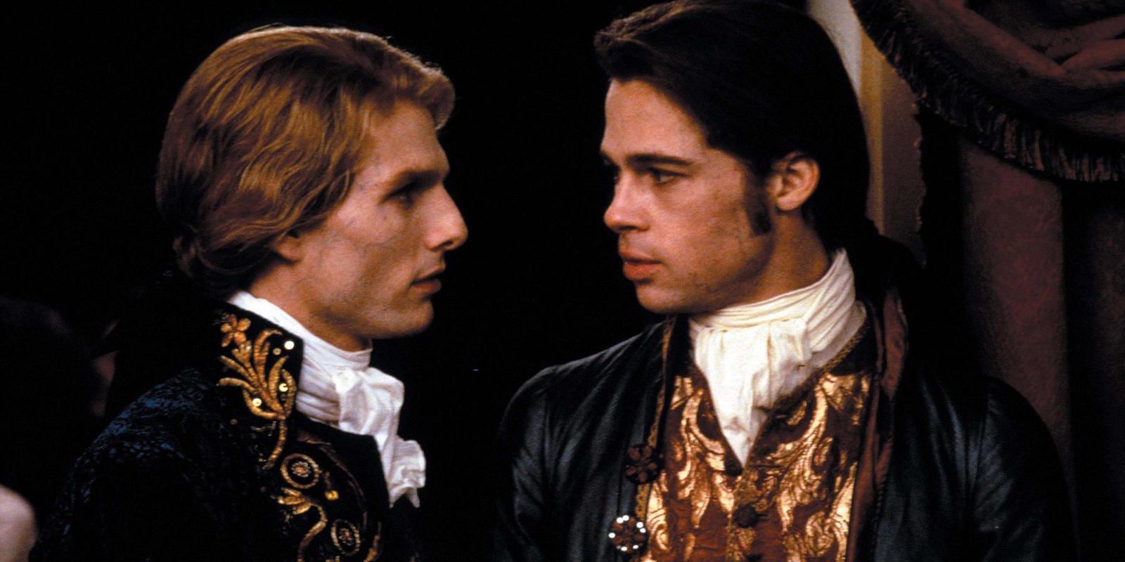 Tom Cruise and Brad Pitt look at each other in Interview with the Vampire