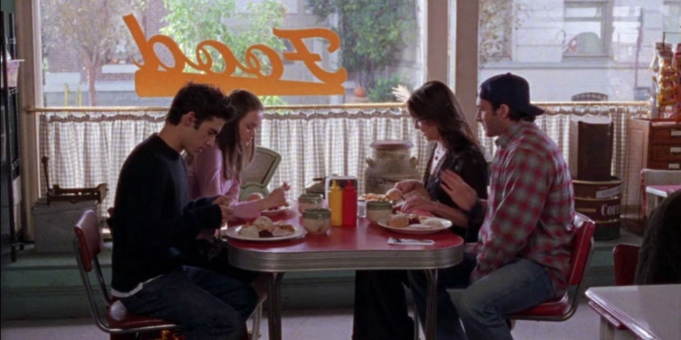 Jess, Rory, Lorelai, and Luke eat at Luke's diner on Gilmore Girls