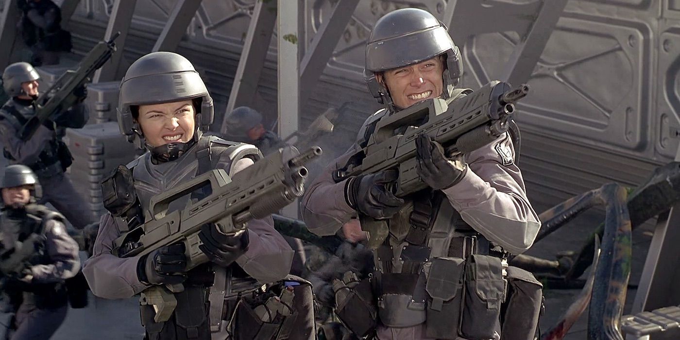 Troopers fire their weapons in Starship Troopers 