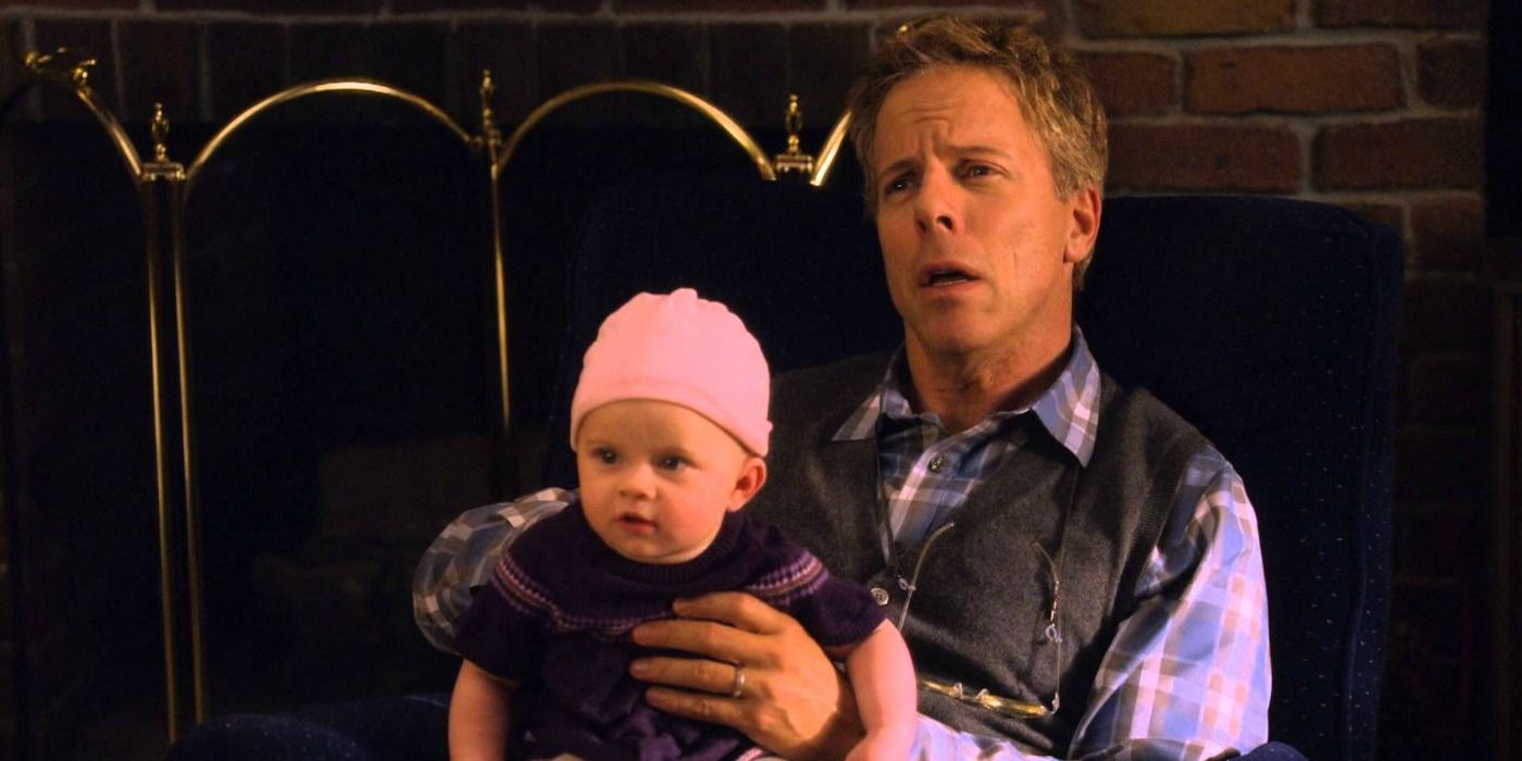 A man holding a baby in Raising Hope