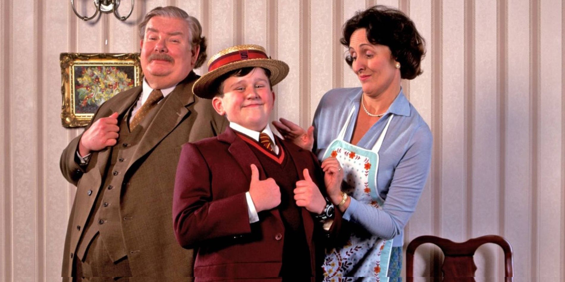 The Dursley family posing together in Harry Potter.