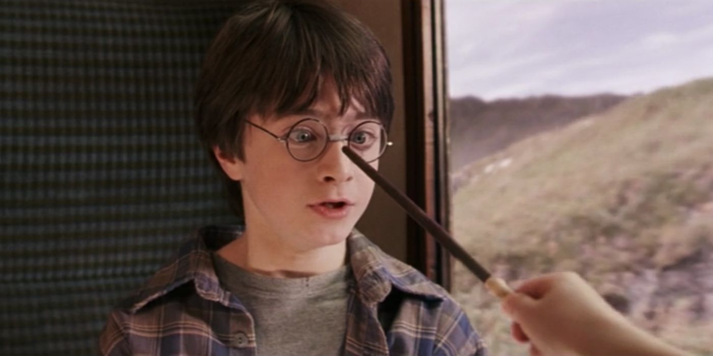 Harry Potter having his glasses repaired by Hermione Granger