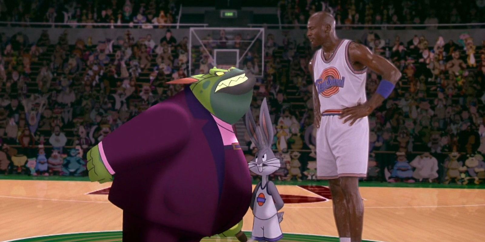 Michael Jordan talking to the cartoon monster villain with Bugs Bunny in between them in Space Jam 