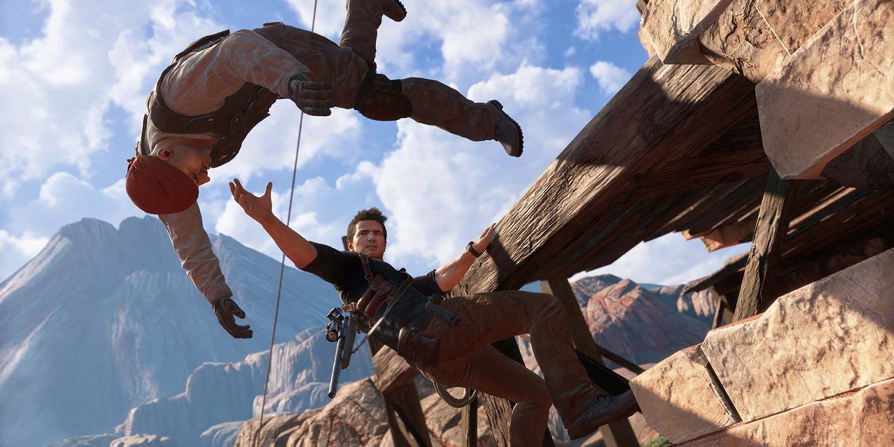 Nathan Drake jogando um inimigo de uma borda em Uncharted 4.