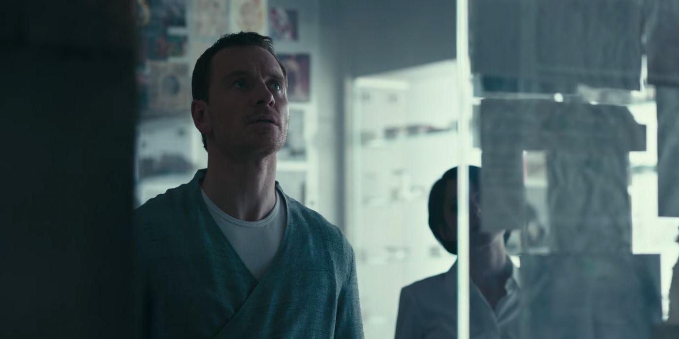 Michael Fassbender as Callum Lynch looking at lab notes in Assassin's Creed
