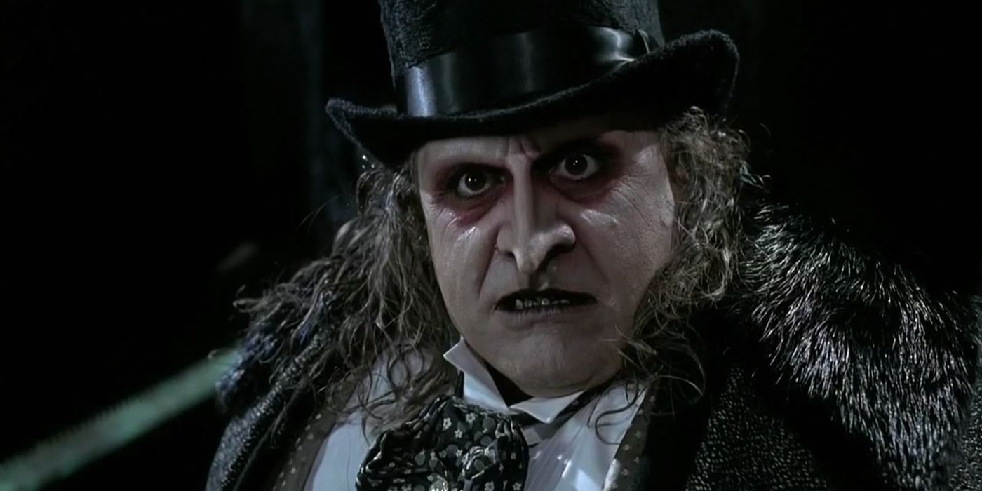 Danny Devito as the Penguin staing at the viewer in Batman Returns.