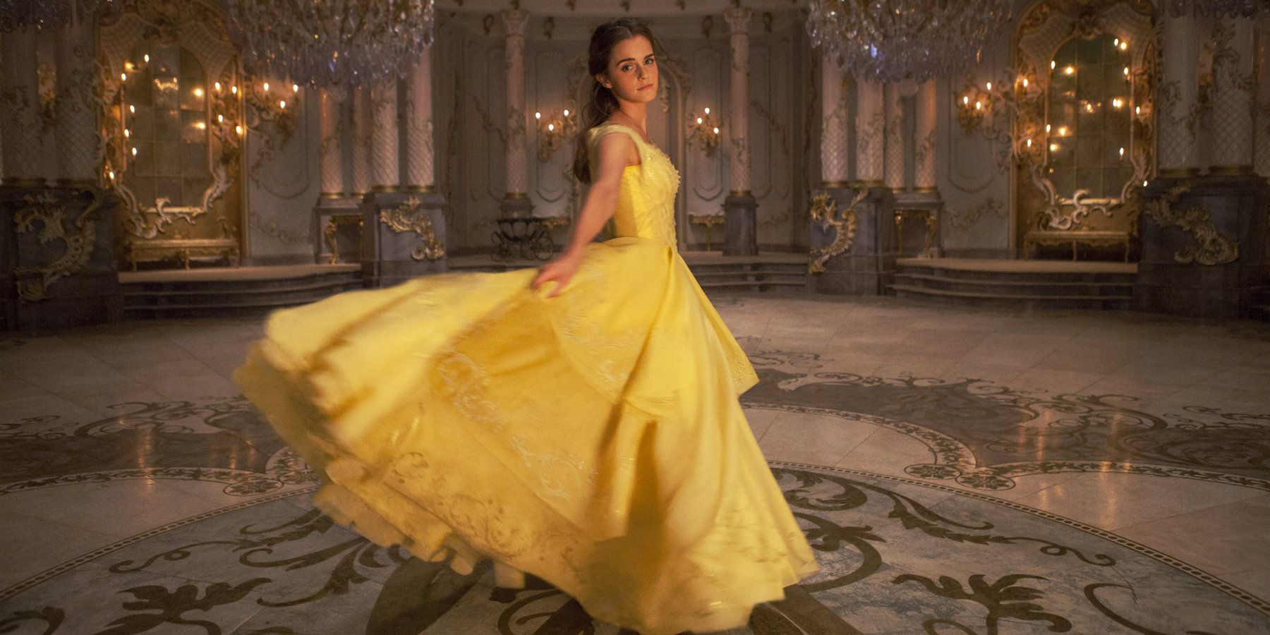 Belle twirls in her yellow dress