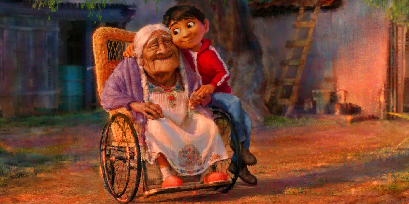 An image of Miguel and Grandma Coco hugging in Coco