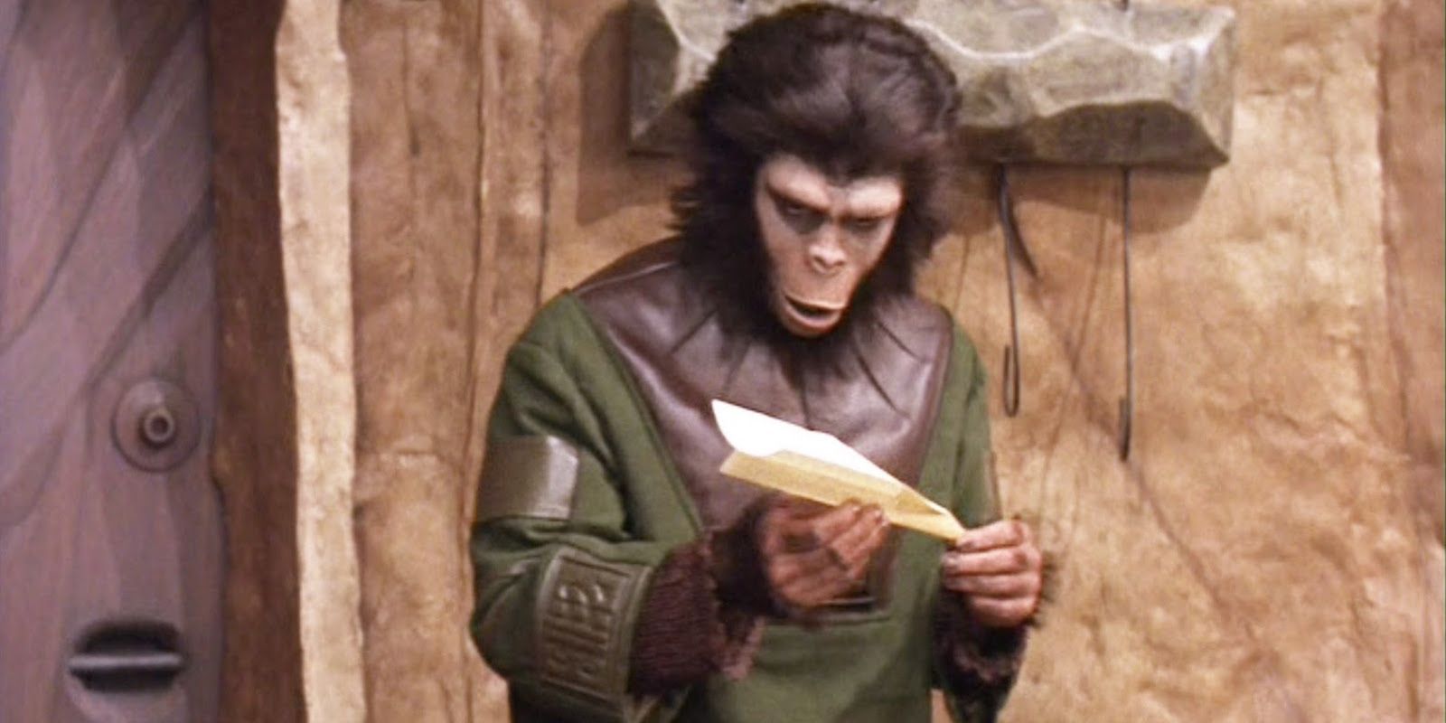 Lisa with a paper airplane in Battle for the Planet of the Apes.