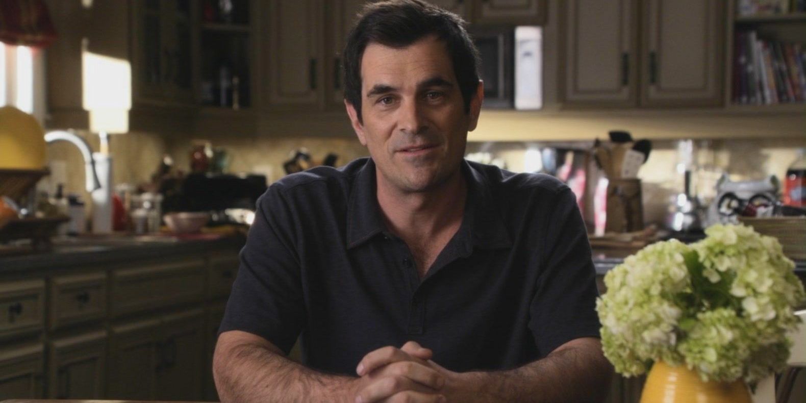 Phil Dunphy in a confessional in his kitchen on Modern Family