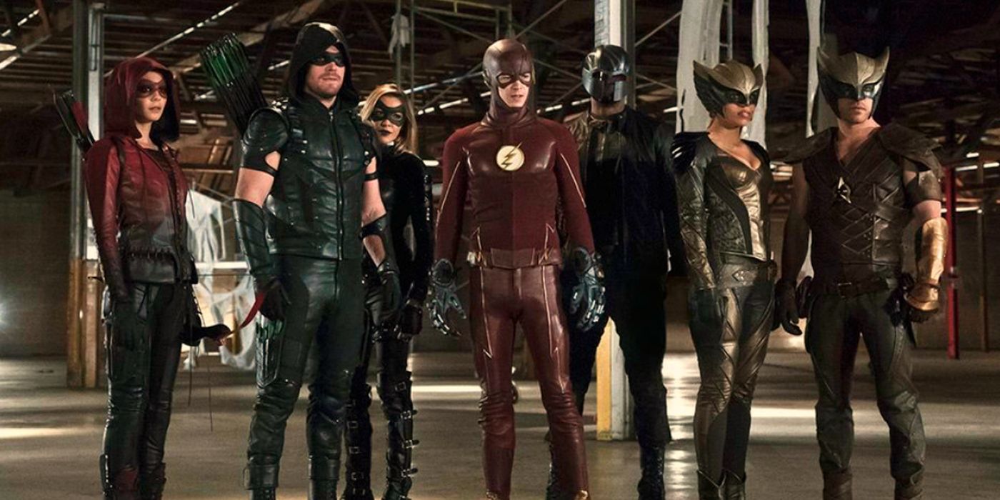 The characters of the Arrowverse standing together, including Legends of Tomorrow, Arrow, and The Flash. 