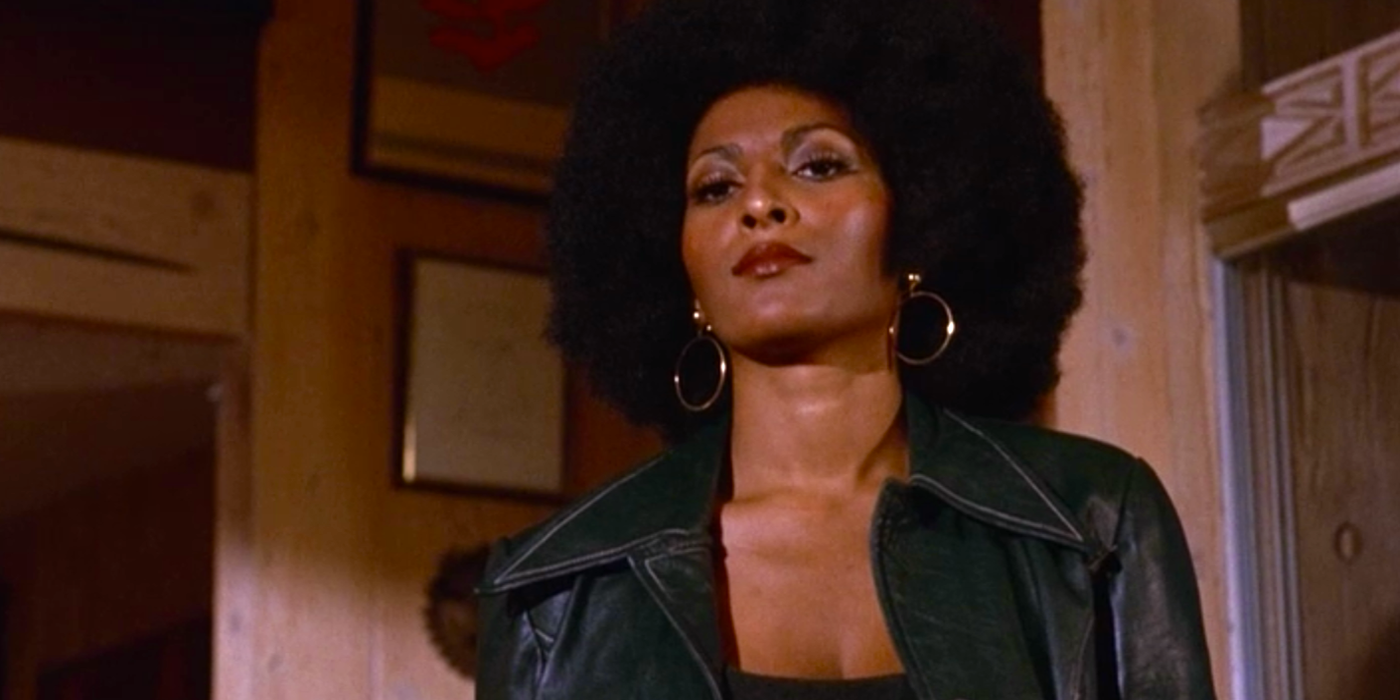 Pam Grier looks down at an offscreen person in the 1974 film Foxy Brown.