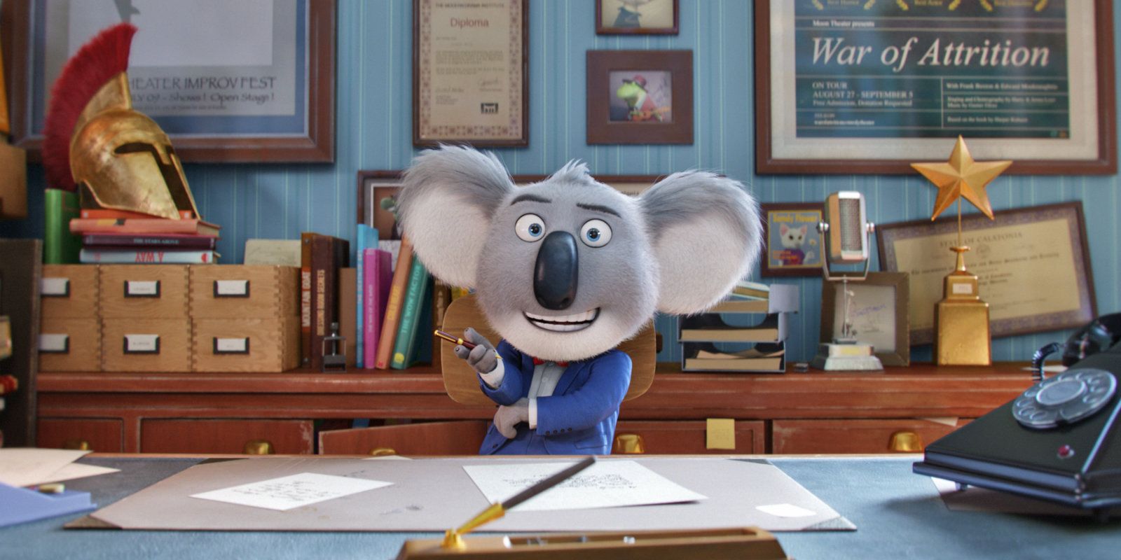 Buster Moon, the koala,sits behind his desk