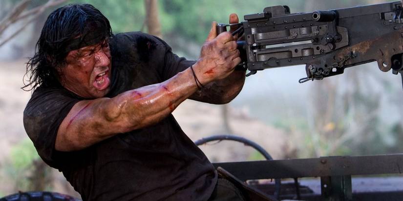 Sylvester Stallone firing a mounted machine gun in Rambo 2008's finale