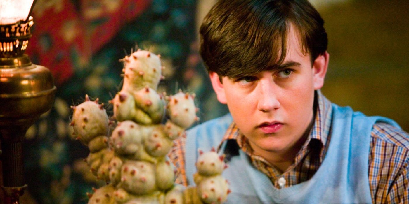 Neville Longbottom and his plant in Harry Potter. 