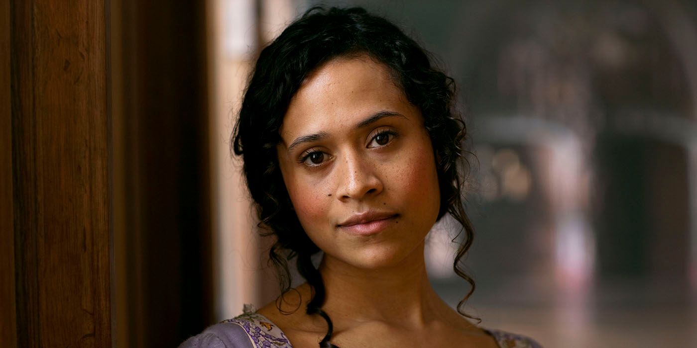 Angel Coulby as Gwen in Merlin, smirking at the camera
