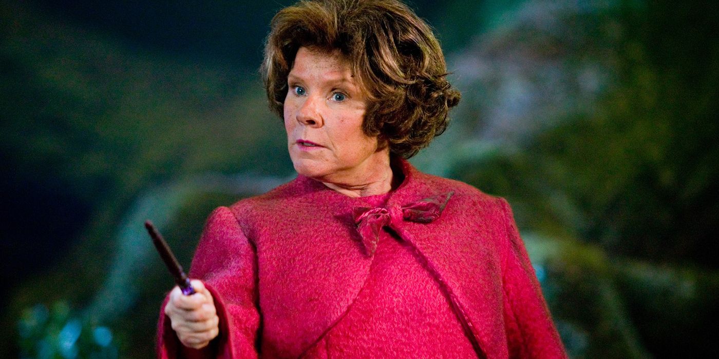 Delores Umbridge holding out her wand in Harry Potter. 