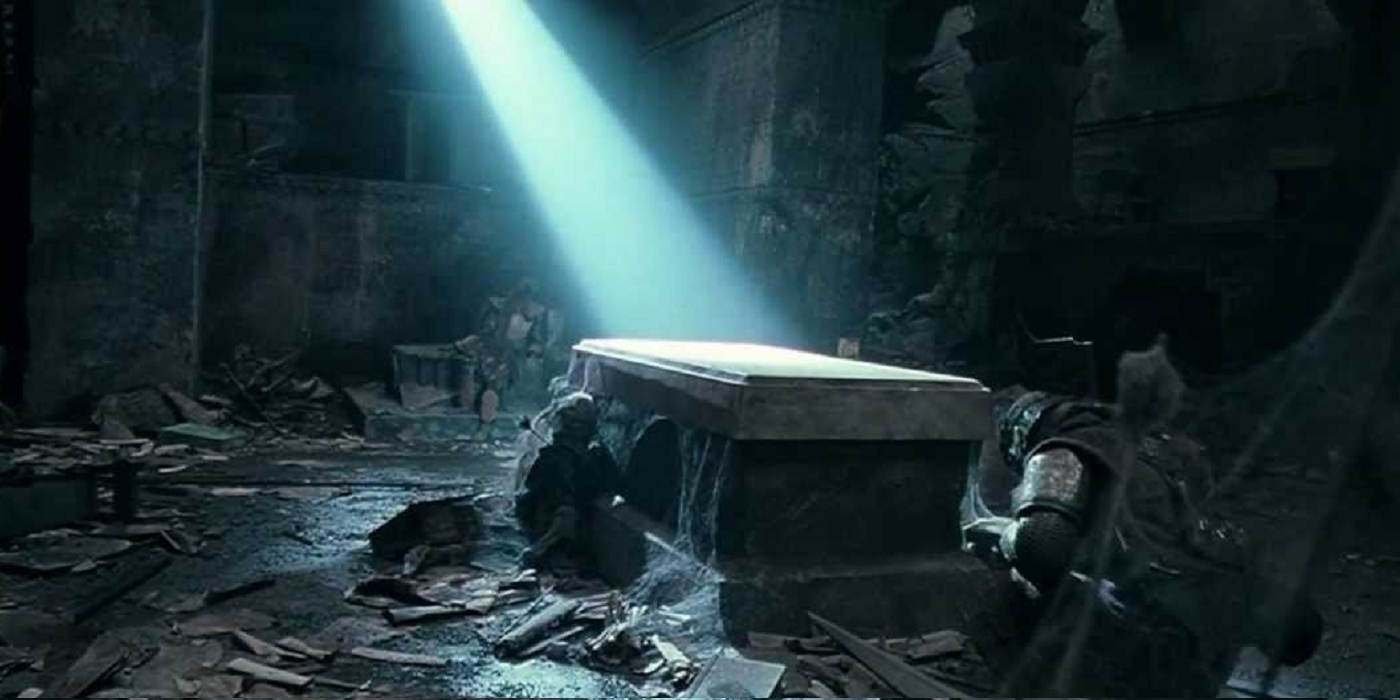 Gimli knees at Balin's tomb in Lord of the Rings