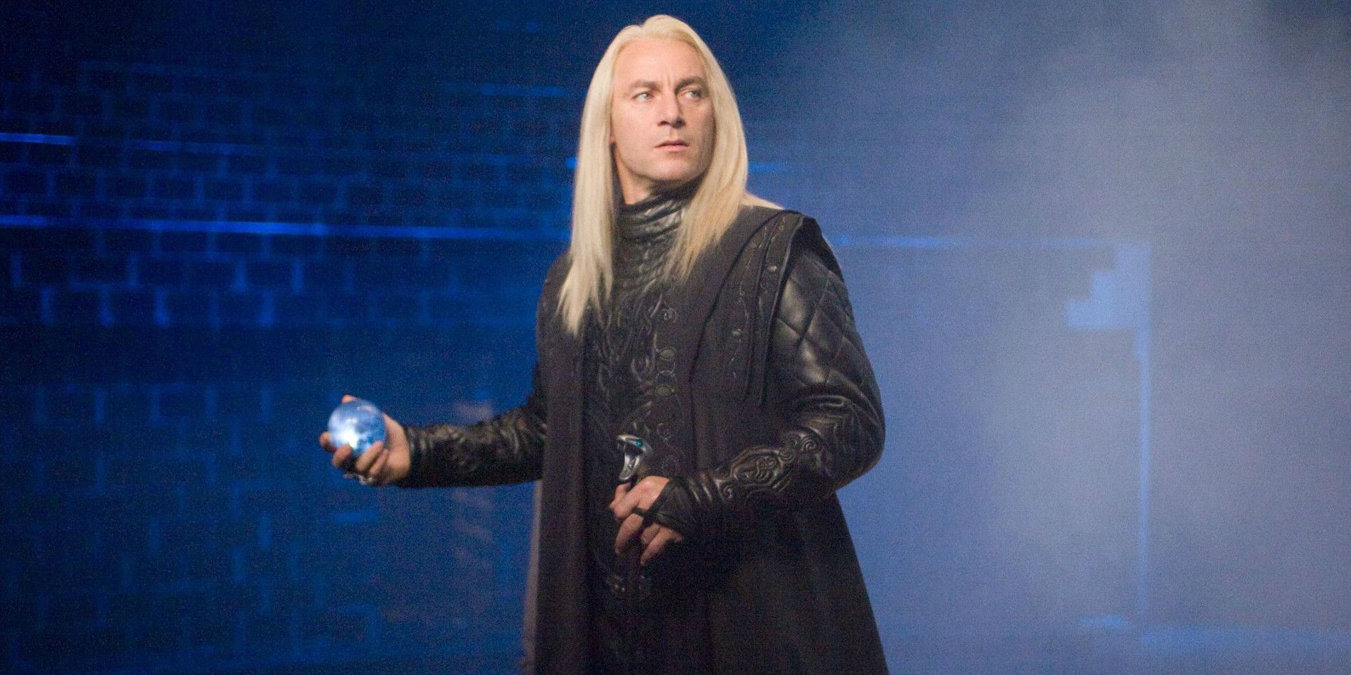 Lucius Malfoy holding a prophecy in his hands in Harry Potter and the Order of the Phoenix