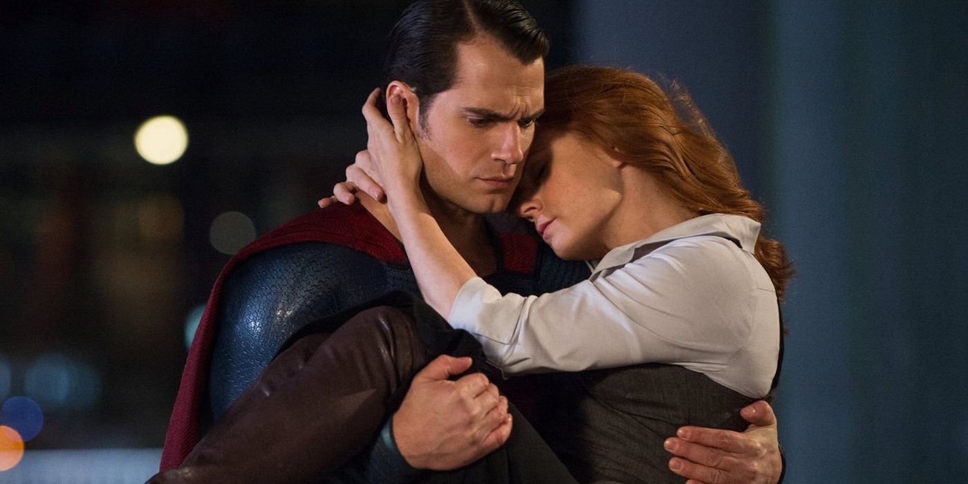 Superman carries Lois Lane in his arms
