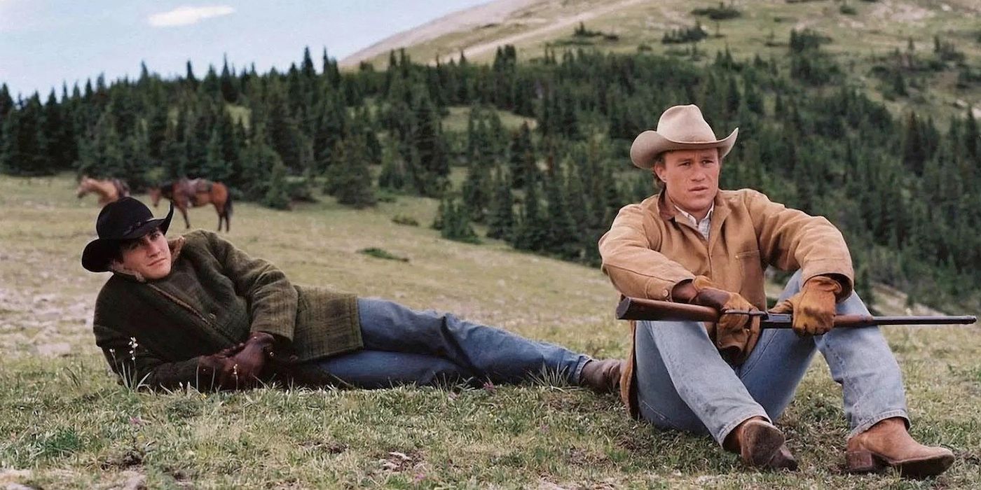 Jake Gyllenhaal and Heath Ledger sit on the floor at Brokeback Mountain