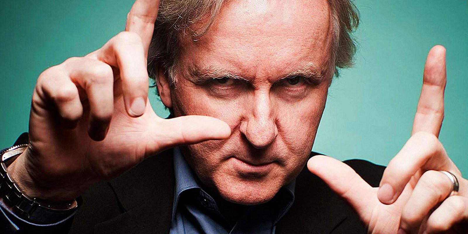 James Cameron looking into camera and framing it with his hands