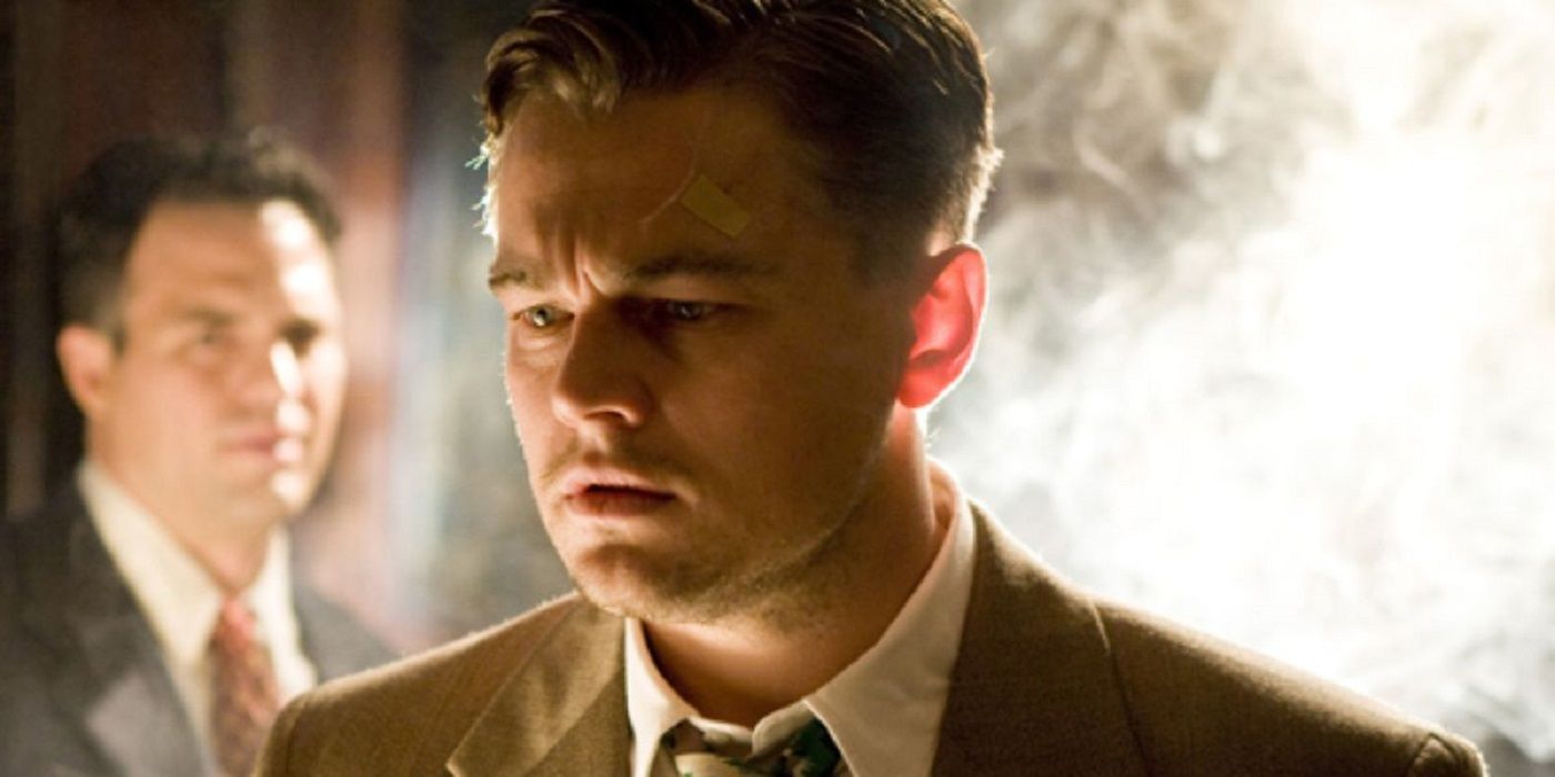 Edward "Teddy" Daniels (Leonardo DiCaprio) with a bandage on his head in front of a cloud of smoke in Shutter Island.