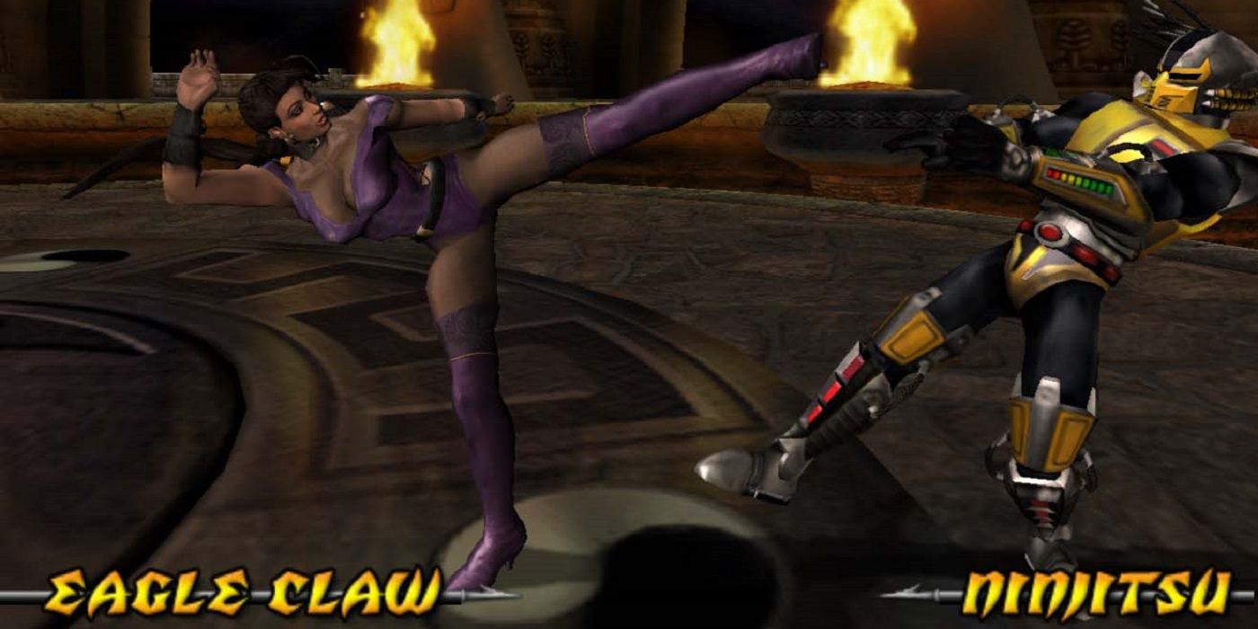 Kitana fights Cyrax in Mortal Kombat: Deadly Alliance