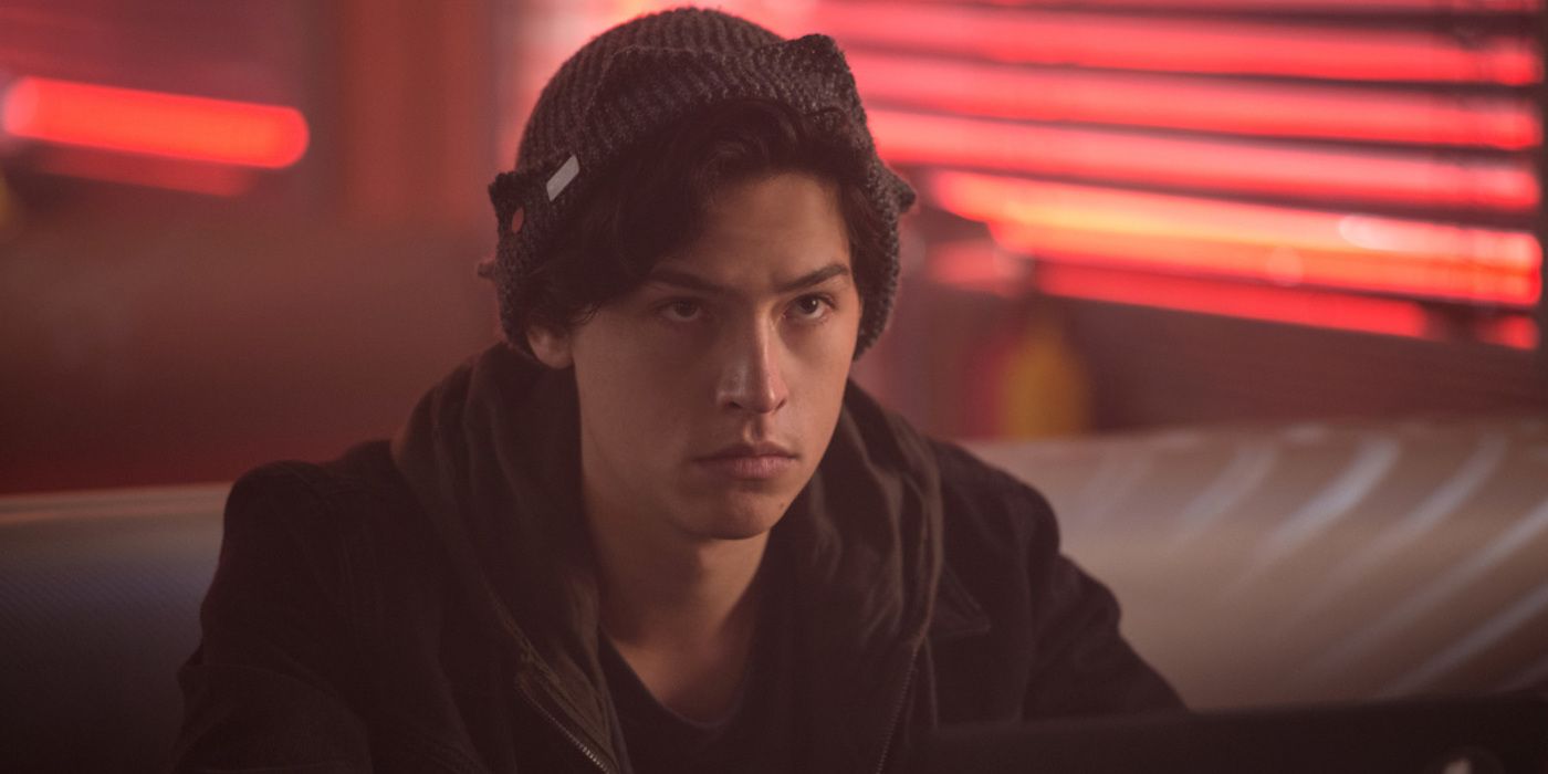 Cole Sprouse as Jughead Jones sitting in the diner on Riverdale