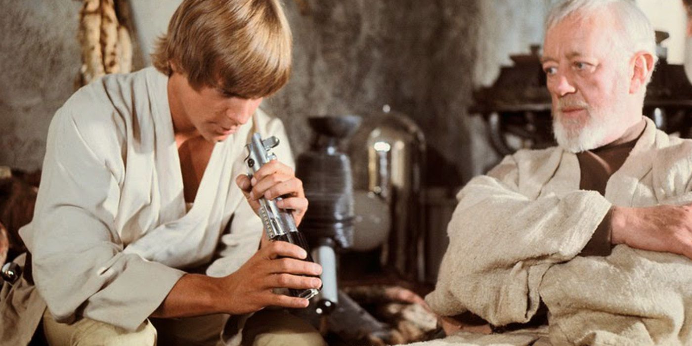 Luke Skywalker olhando para o sabre de luz com Obi Wan