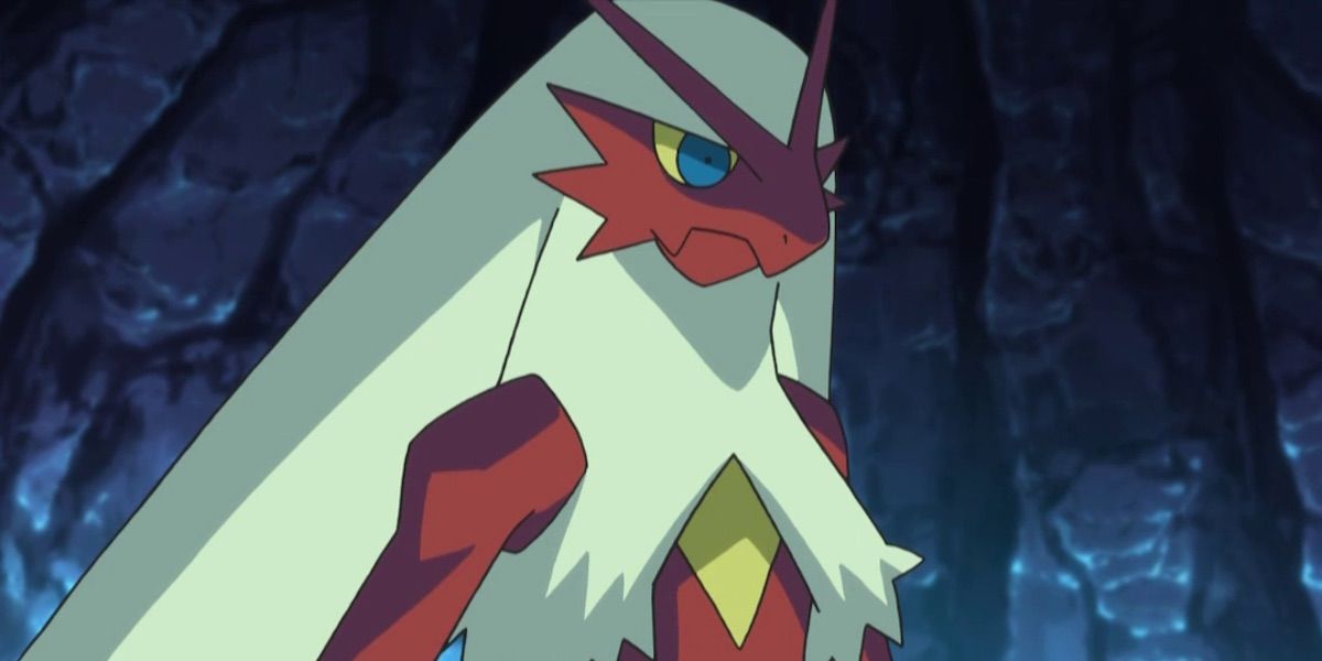 Blaziken stands in shadow glowering in the Pokémon anime.
