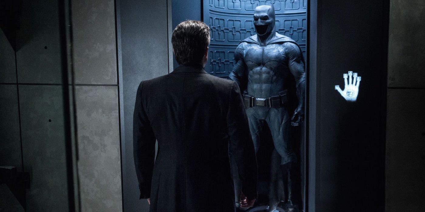 Bruce Wayne Stares at Batsuit