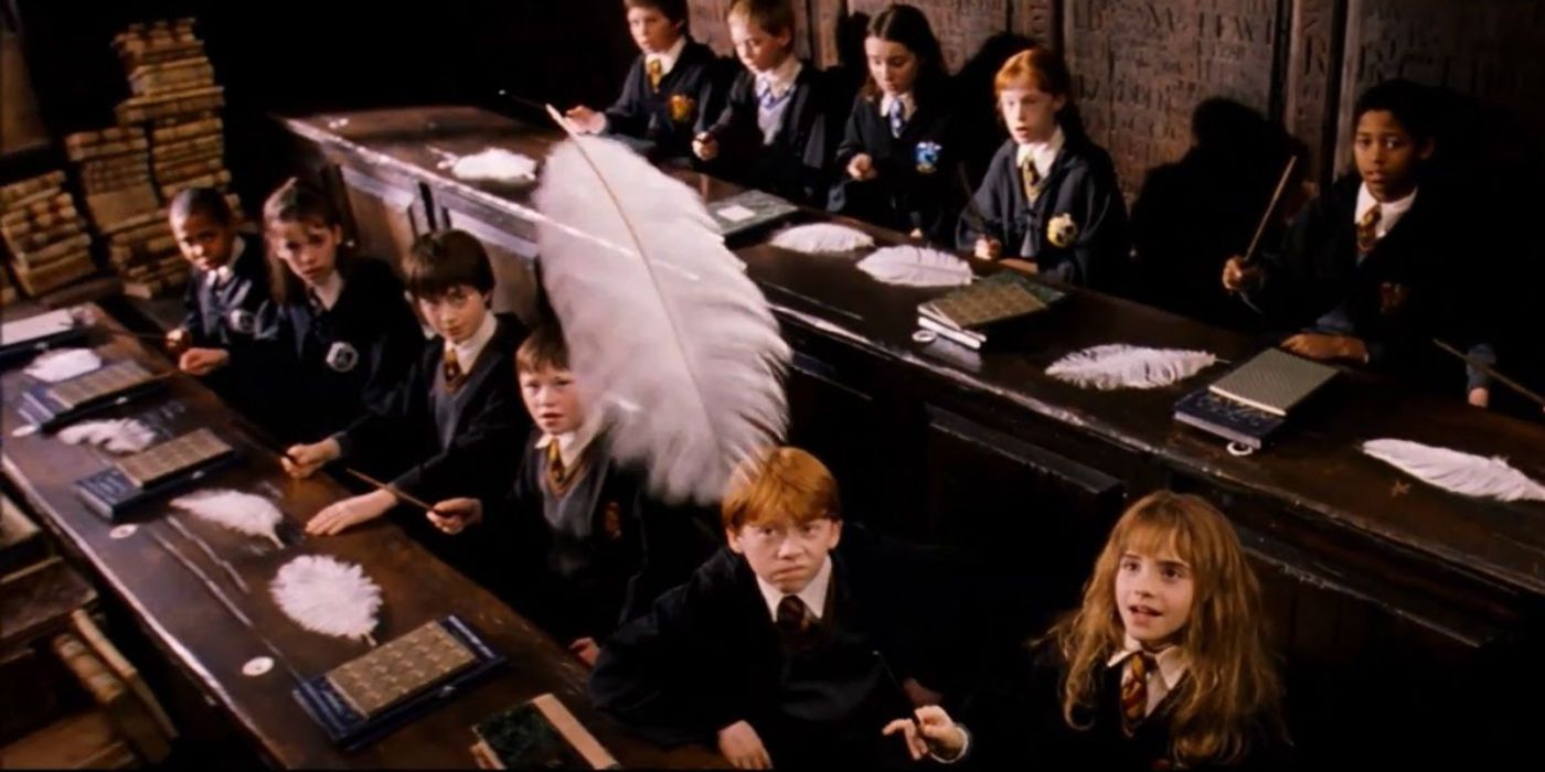 Emma Watson as Hermione Granger and Rupert Grint as Ron Weasley in Charms Class