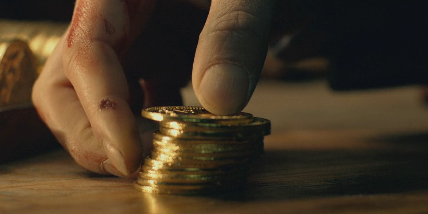 Gold coins on a table in John Wick.