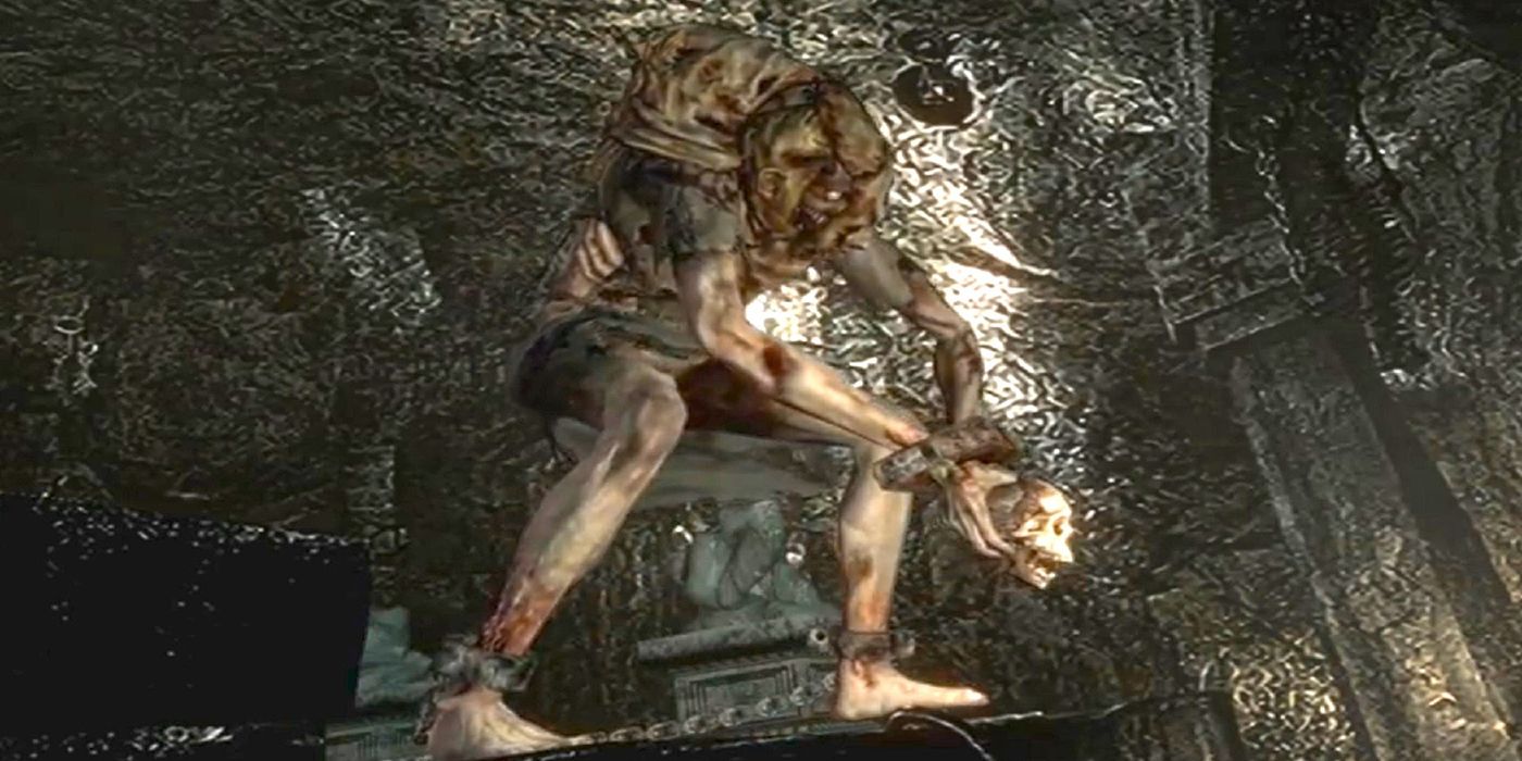 Lisa Trevor stands and holds a skull in Resident Evil