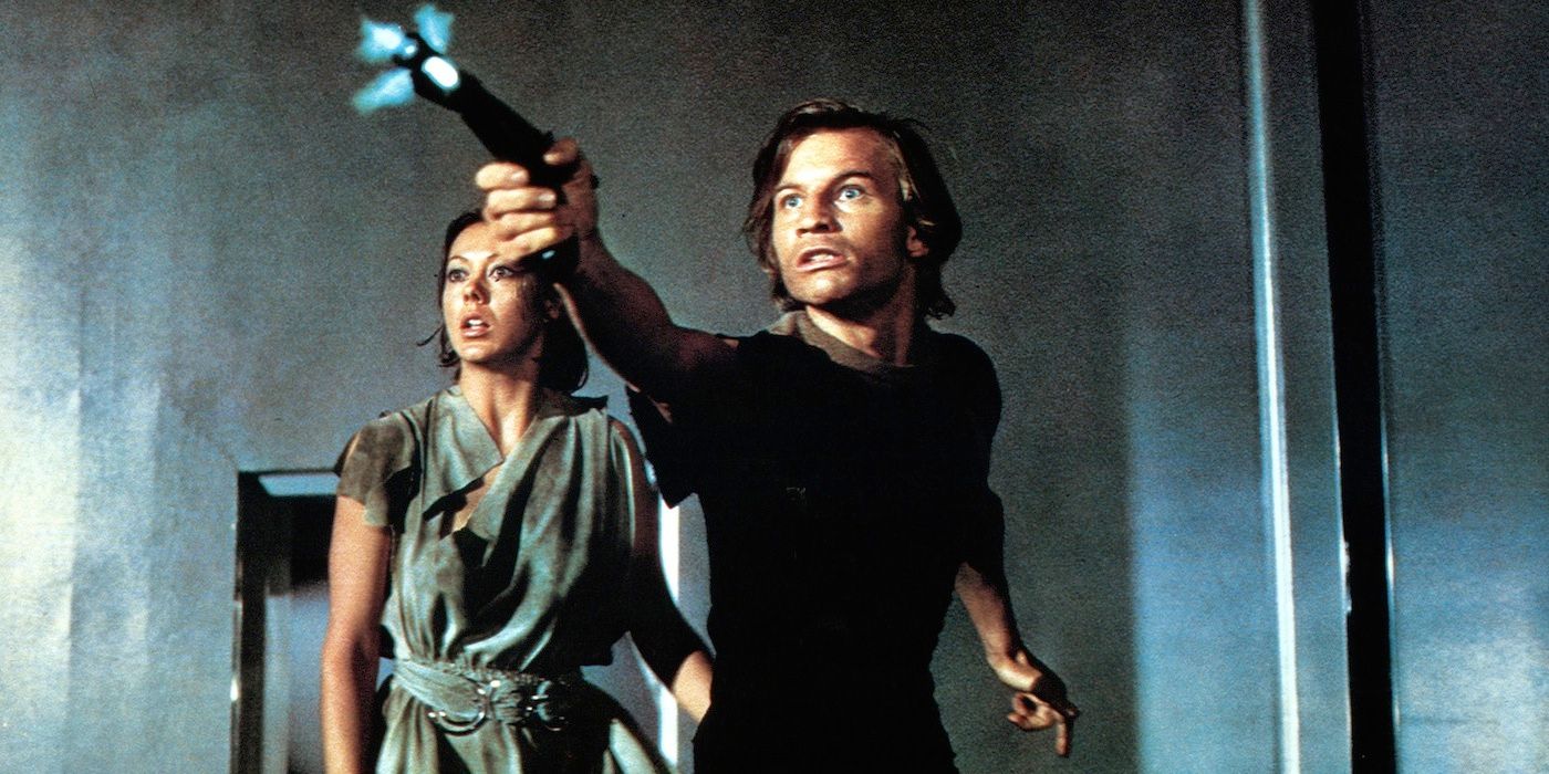 Logan points a gun while Jessica watches in Logan's Run