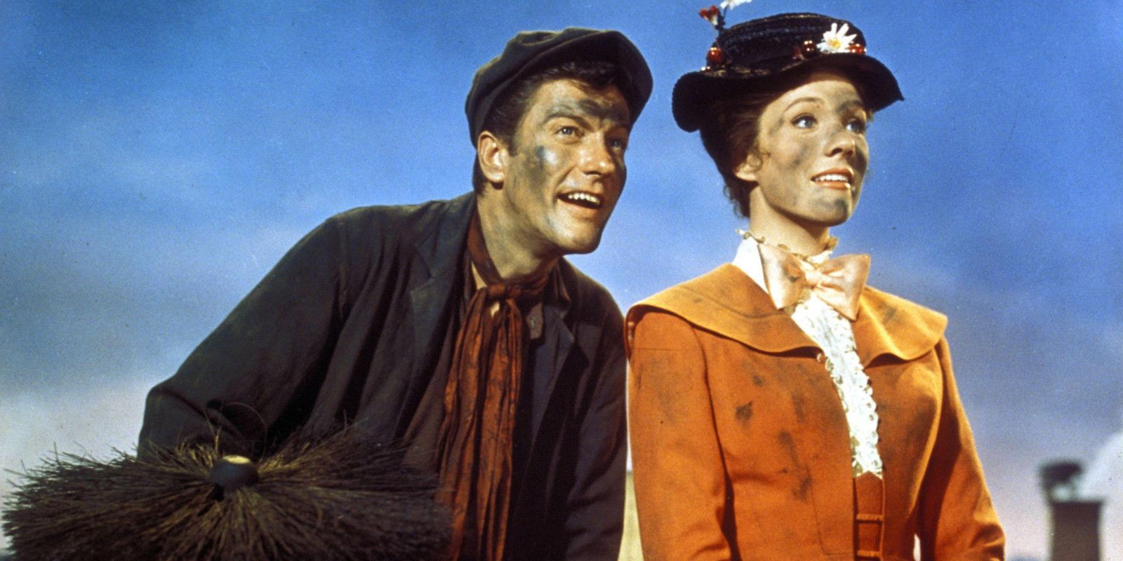 Mary Poppins and Bert sits on top of a house with dirty faces in Mary Poppins
