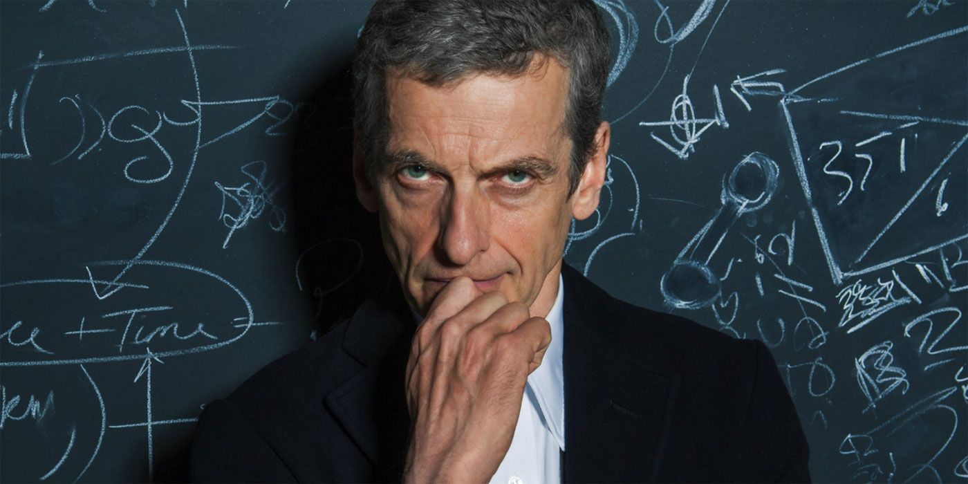 The Twelfth Doctor looking suspicious in front of a blackboard in Doctor Who